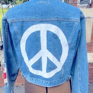 Upcycled Denim Jacket with Peace Sign and patriotic sleeves.